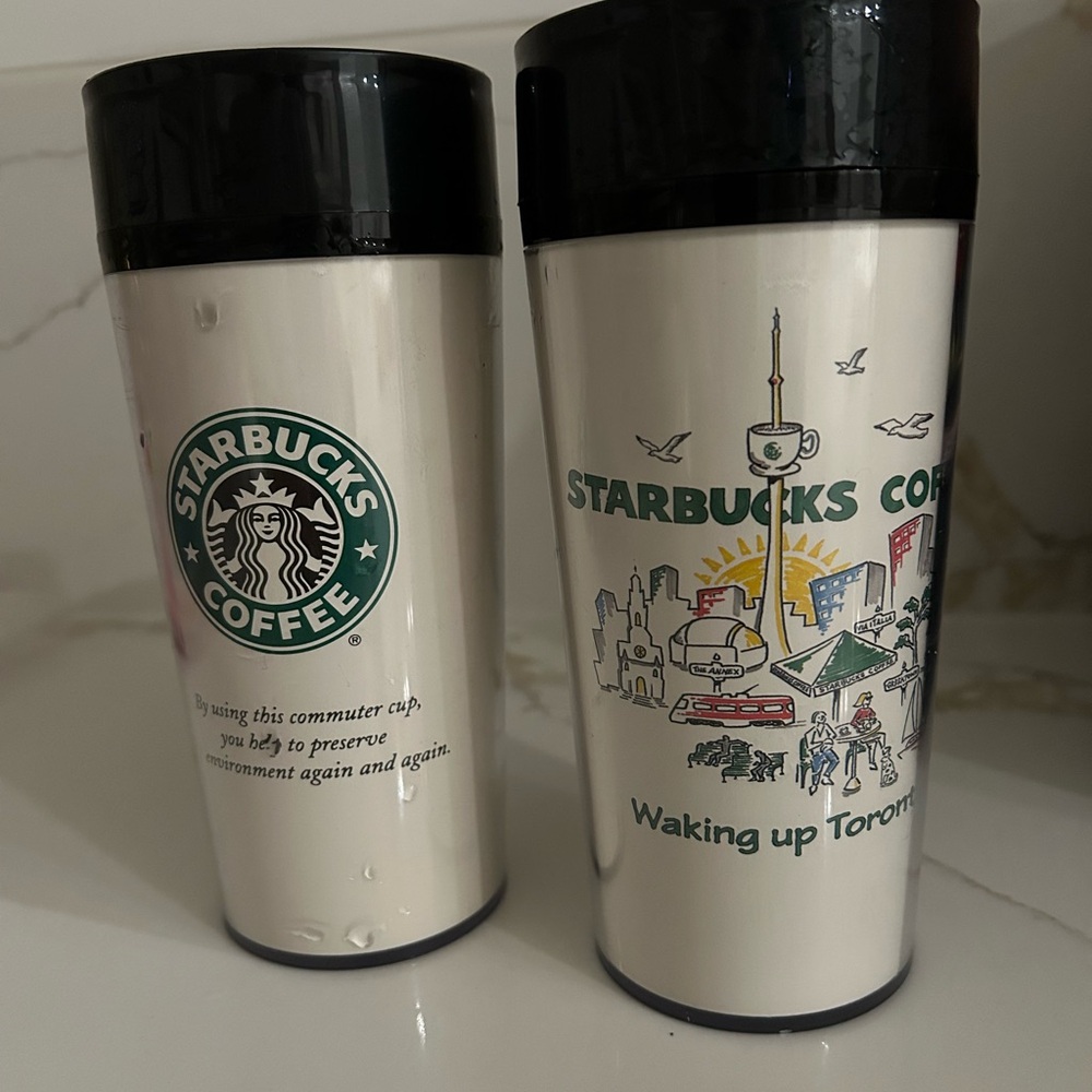 Starbucks 'Waking up Toronto' plastic travel mugs.